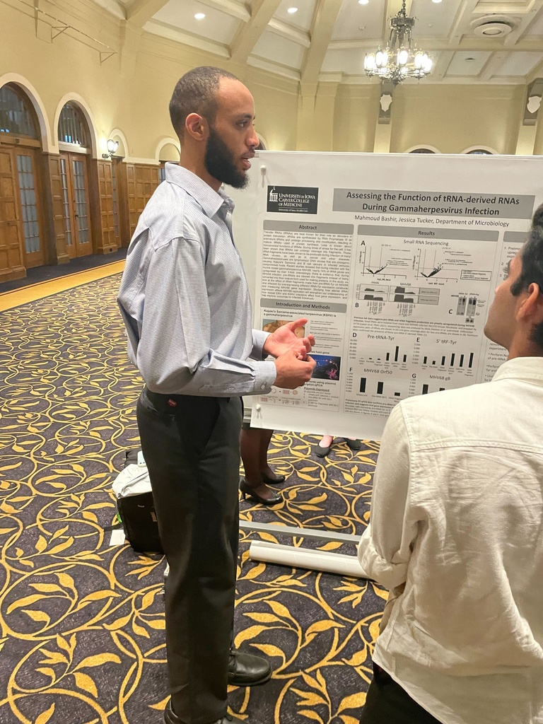 Mahmoud presents his poster at the Summer Undergraduate Research Conference.